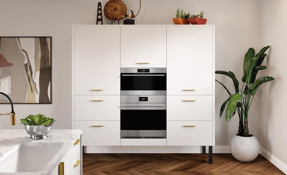 Wolf 30&quot; E Series Transitional Convection Steam Oven (CSO3050TE/S/T) immersed in a sleek white French kitchen