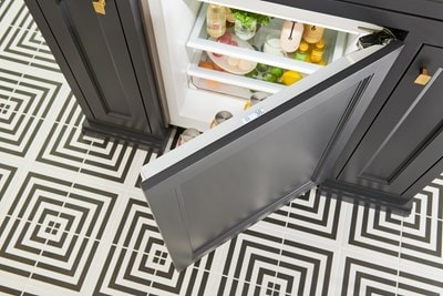 Aerial view of Sub-Zero 24" Designer Undercounter ADA Height Refrigerator - Panel Ready (DEU2450R/ADA) door with touchscreen panel for settings control