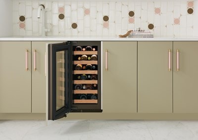 Six shelves with interior lights shining on a variety of wine bottles lying in Sub-Zero 15" Designer Undercounter Wine Storage - Panel Ready (DEU1550W)