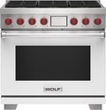 Wolf 36" 6 Burner Dual Fuel Range (DF36650/WH/P) featuring white accent colored door and signature red Wolf knobs.