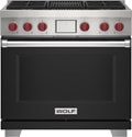 Wolf 36" 4 Burner Dual Fuel Range with Infrared Charbroiler (DF36450C/BK/P) featuring black accent colored door and signature red Wolf knobs.