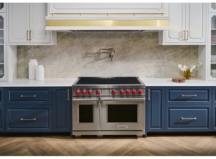 The new Professional Induction Range featuring the iconic red knobs for superior control from Wolf Appliances.