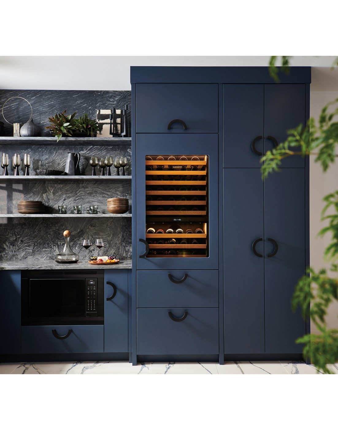 Sub-Zero 30 Inch Wine Column for High Altitude shown set flush within a custom midnight blue butler's pantry outfitted with rod iron handles