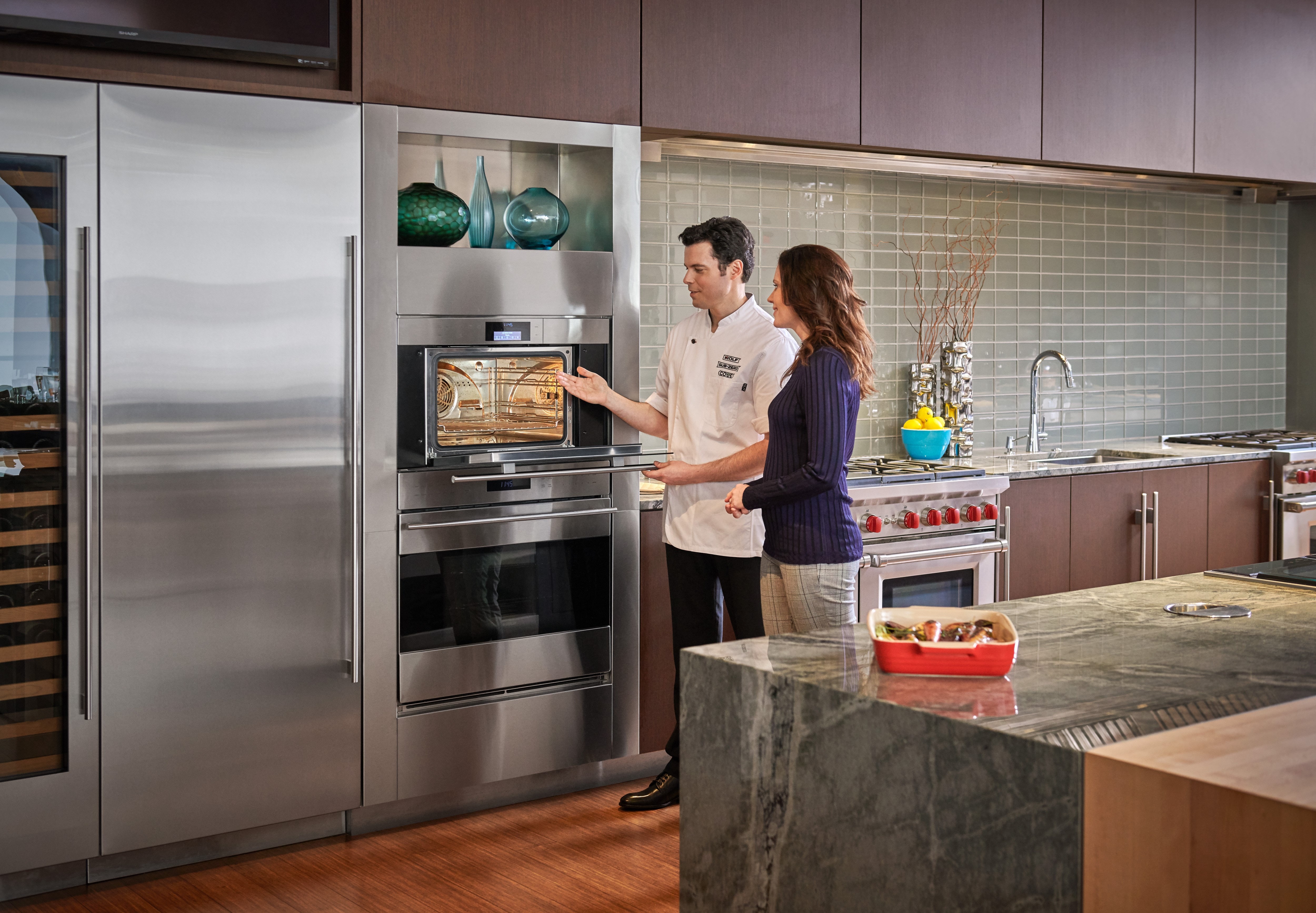 Use and care product demonstration featuring Wolf cooking with Chef at Sub-Zero, Wolf and Cove Showroom