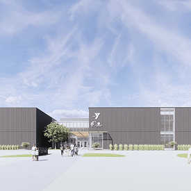 A child helps the health of her community as she plants produce with the help of Matthew 25 in Cedar Rapids, IA.