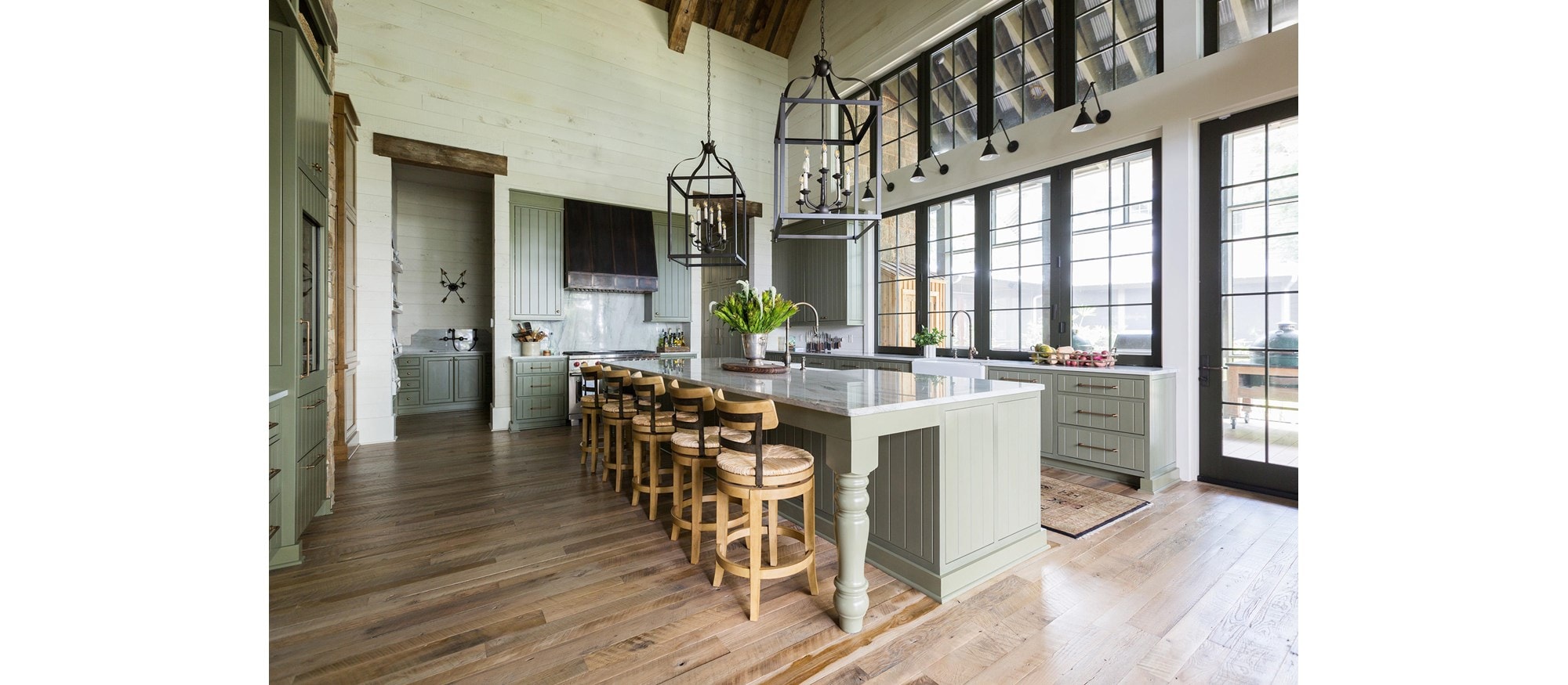 Bayfront Rustic Hideaway kitchen by Erika Powell is a warm, welcoming backdrop for future guests.