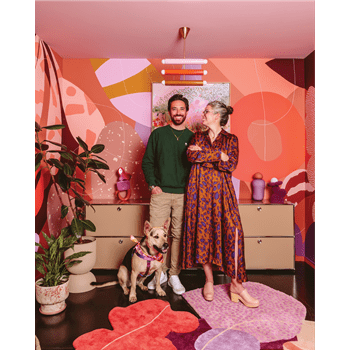 Artist Alex Proba, known for her colorful creations, pictured right, at home with her partner, Ian Coyle, pictured left.