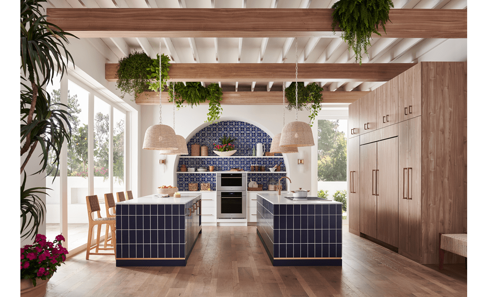 Wolf 30 Inch M Series Transitional Convection Steam Oven displayed in a Mediterranean kitchen design featuring double island, custom blue tile backsplash and exposed wood beam ceiling 