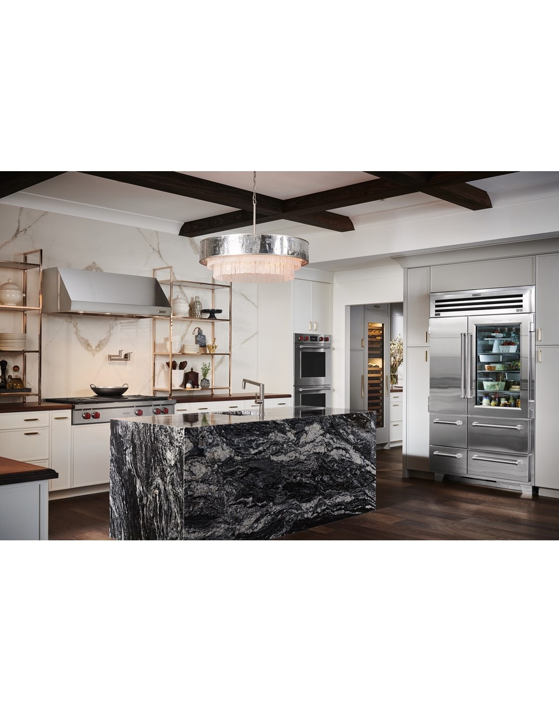 Sub-Zero 48 inch Pro Refrigerator and Freezer with Glass Door displayed in a custom kitchen design featuring large marble kitchen island