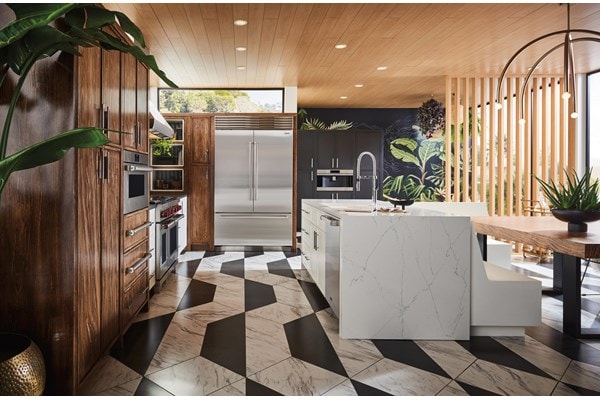 Sub-Zero Classic Series Refrigerator built into stained wood custom cabinetry in sunlit and earthy kitchen