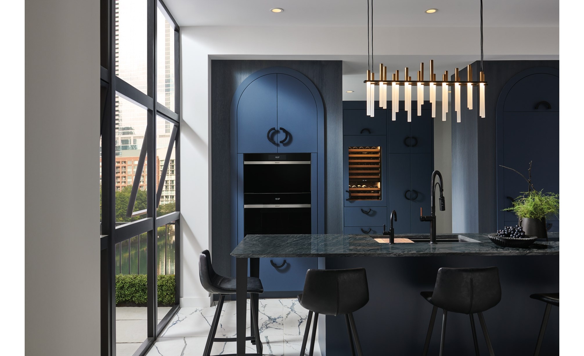 Wolf Contemporary Steam Oven (CSO3050CM) set over a Wolf Contemporary Single Oven (SO30CM) in midnight blue arched cabinets