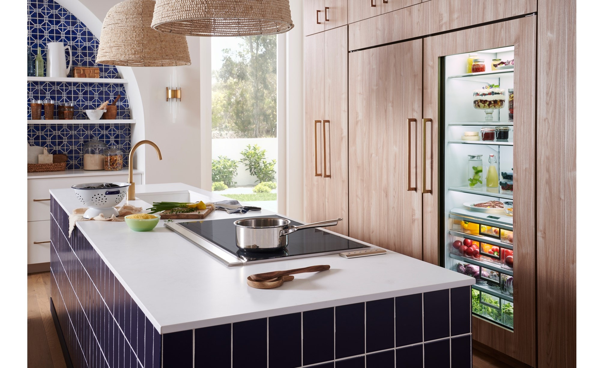 Mediterranean style kitchen featuring Wolf 36-inch induction cooktop