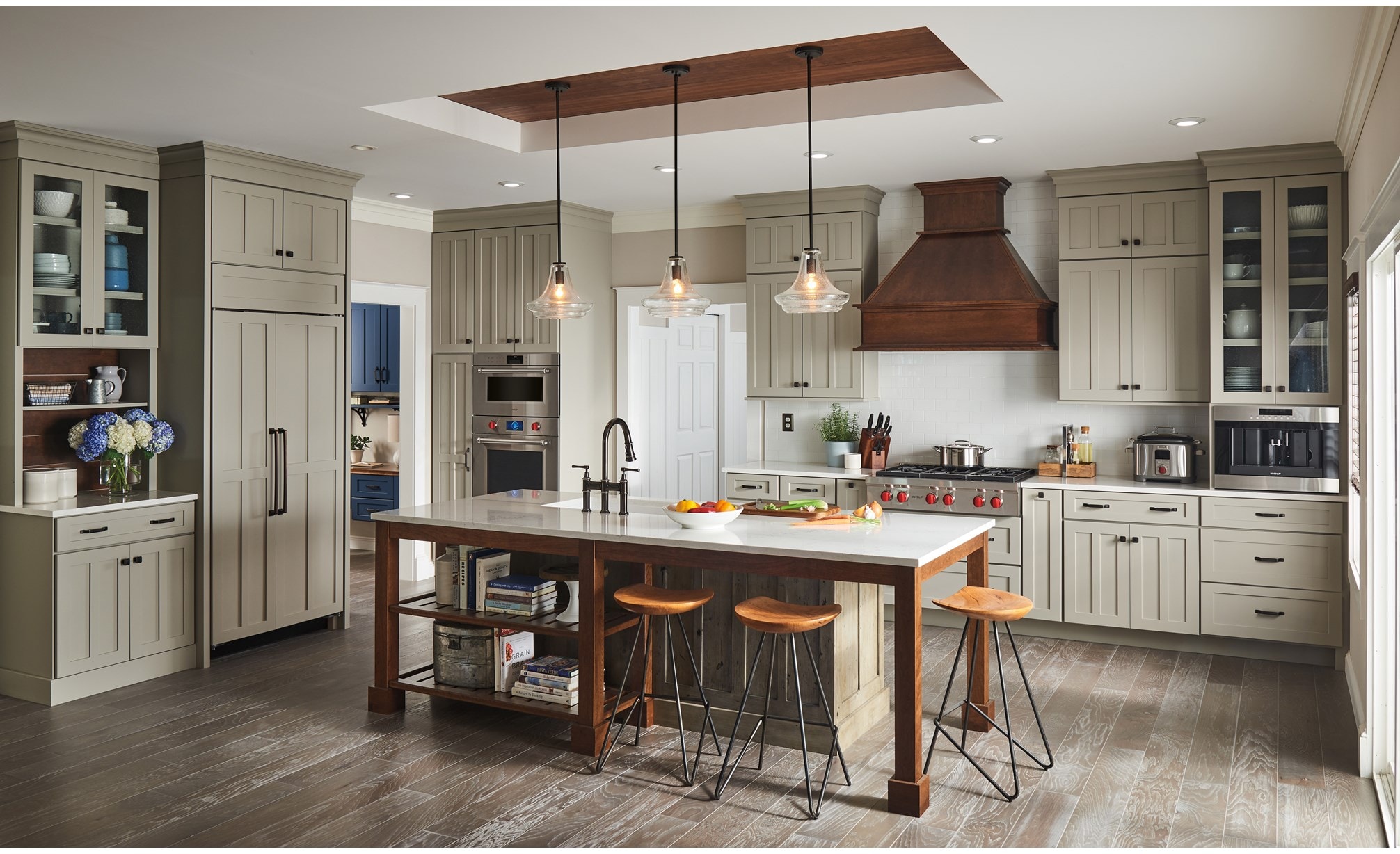 The Wolf 36" Sealed 6 Burner Rangetop (SRT366) is undeniably charming in this rustic style kitchen featuring farm table