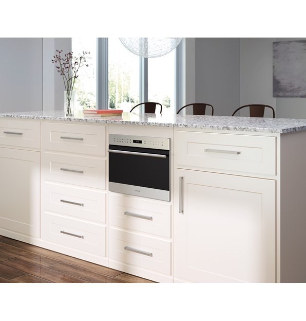 Wolf 24" E series Transitional Drop-Down Door Microwave Oven (MDD24TE/S/TH) adding maximum counter space in classic white kitchen design