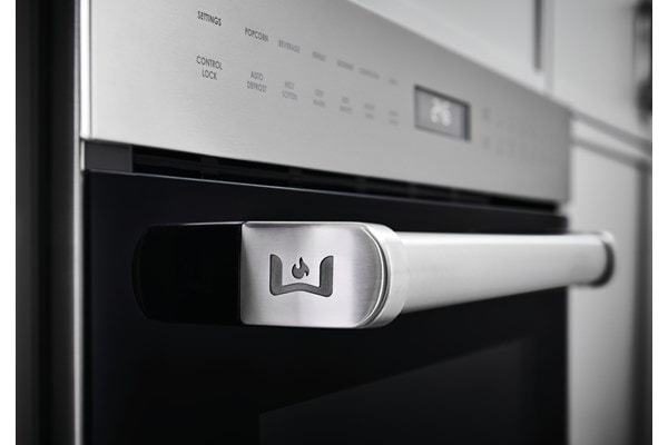 Wolf Speed Oven (SPO24TE/S/TH) shown with iconic Wolf emblem on available Pro Handle. View all Speed Ovens.