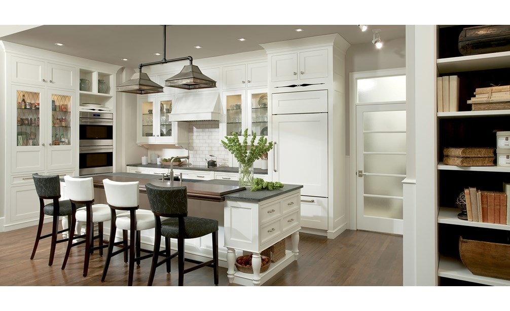 The Wolf 30" E Series Transitional Built-In Double Oven (DO30TE/S/TH) shown complementing a crisp integrated classic kitchen design.