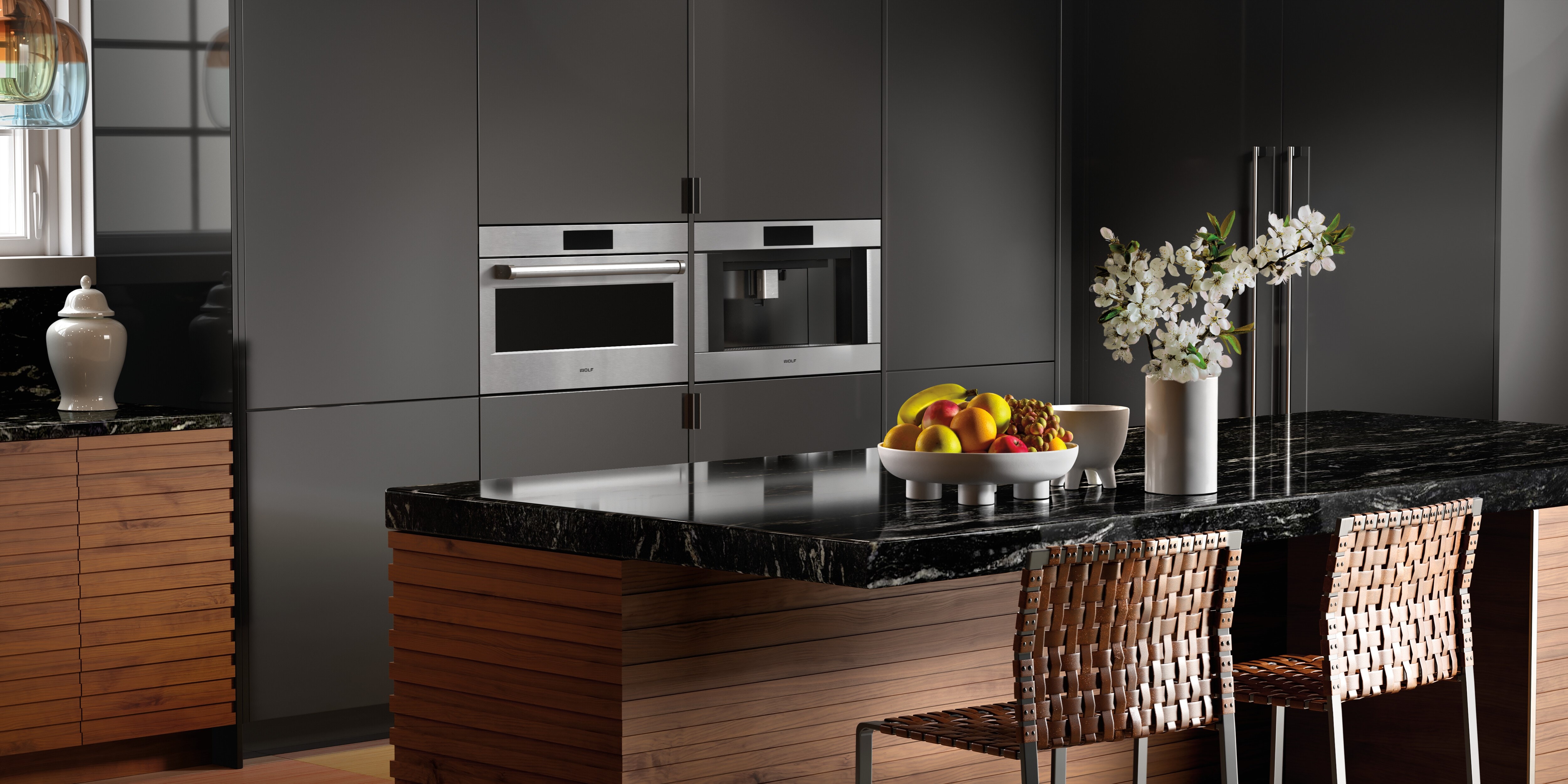 The Wolf 30" E Series Professional Speed Oven - SPO3050PE/S/P next to a Wolf Coffee System