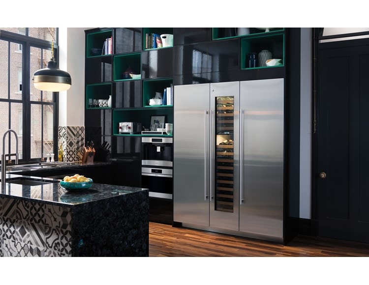 Wolf 24" M Series Contemporary Stainless Steel Steam Oven (CSO2450CM/S) displayed in powerful black cabinetry alongside Volga blue granite countertops
