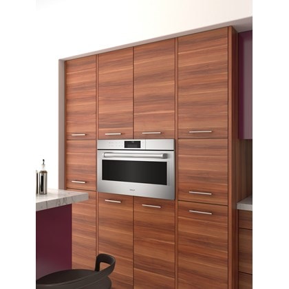 The Wolf 30" E Series Professional Convection Steam Oven (CSO30PE/S/PH) shown elevated and framed in a sophisticated cabinet style 