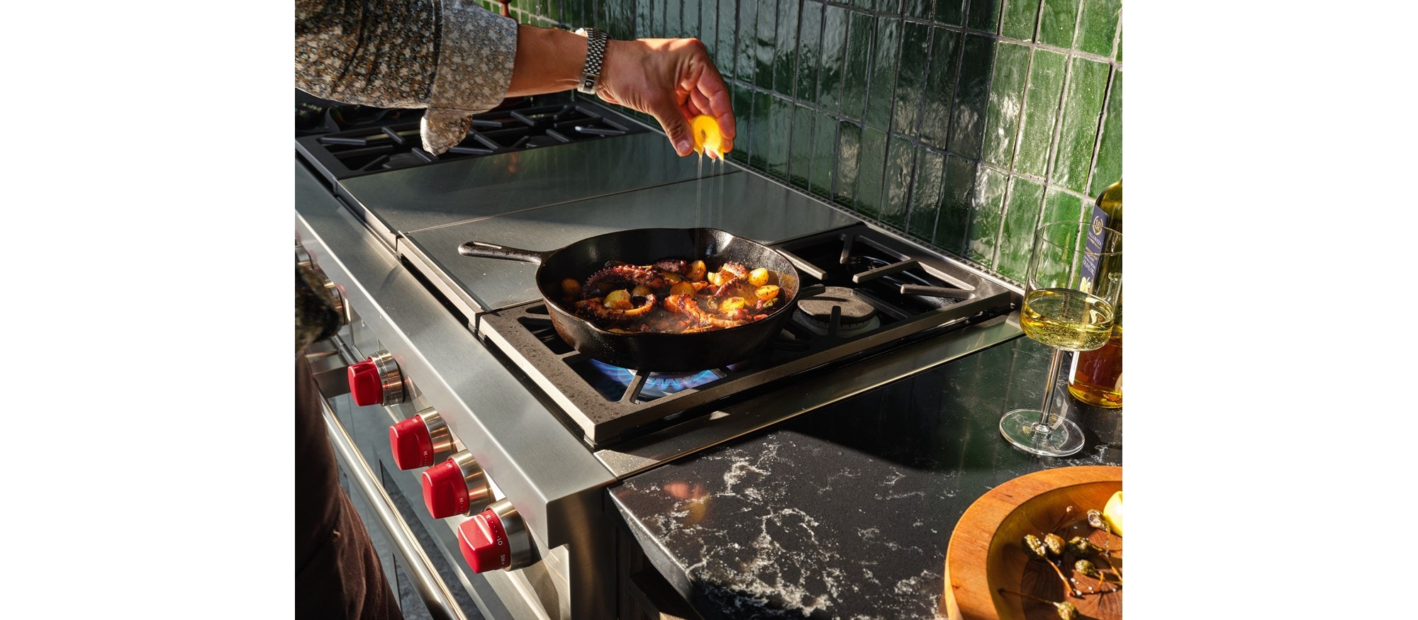 Wolf Dual Fuel Range featured searing lamb chops and sauteing cherry tomatoes with control and finesse