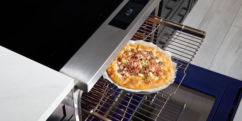 Wolf 36" Induction Range (IR36550/S/T) with Dual VertiFlow™ convection system delivers consistent multi-rack cooking as seen here with a tomato galette.