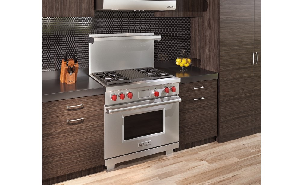 The Wolf 36" Dual Fuel Range 4 Burner Infrared Charbroiler (DF364C) shown delivering state of the art cooking technology in a natural kitchen design.