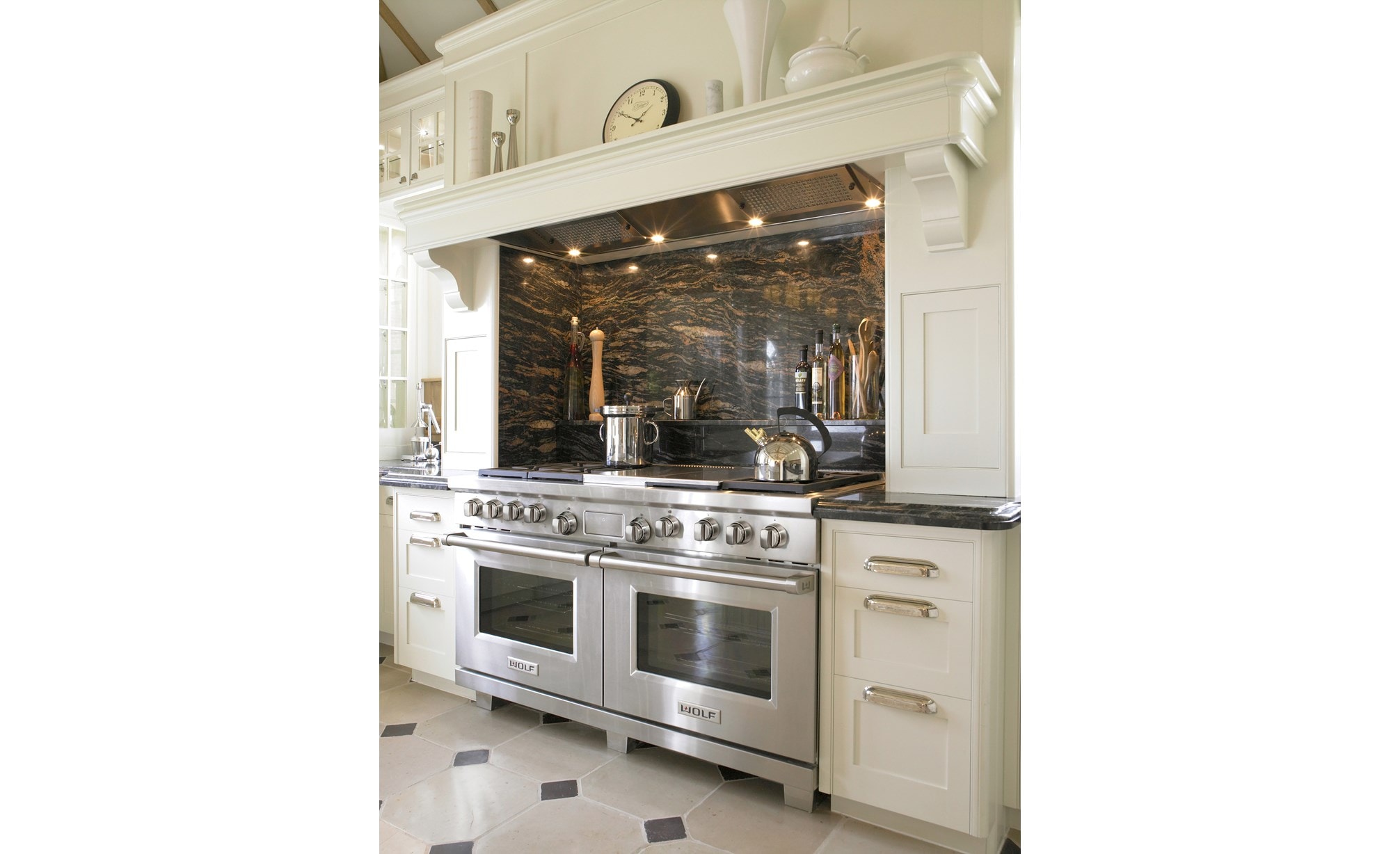 The Wolf 60" Dual Fuel Range 6 Burner Infrared Charbroiler Griddle (DF606CG) shown with signature stainless steel control knobs.