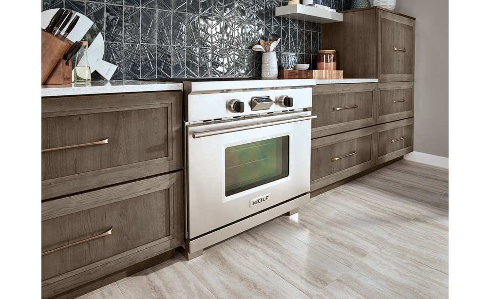The Wolf 36" Transitional Induction Range (IR365TE/S/TH) featured with Wolf Gourmet Cutlery (WGCU100S)
