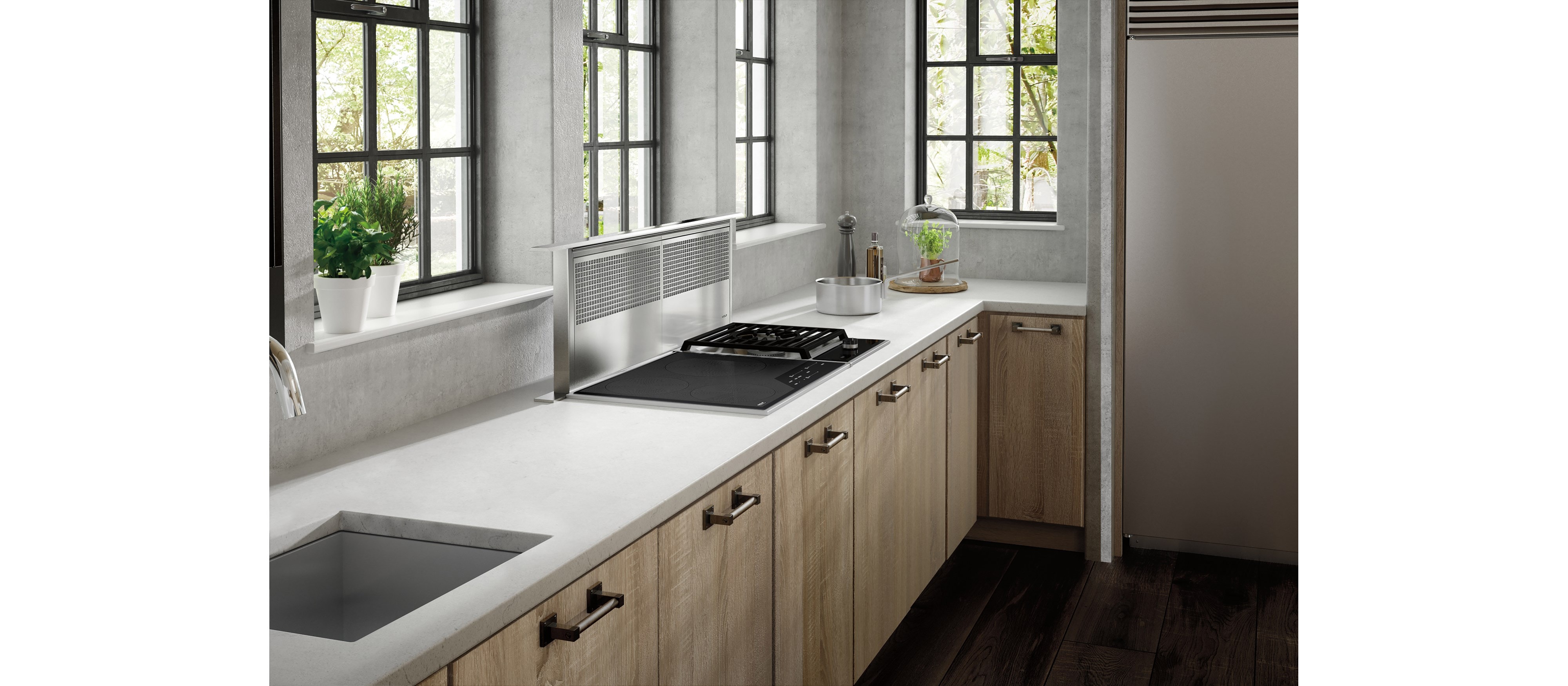 The Wolf 45" Downdraft Ventilation (DD45) featured in a bright and open kitchen design featuring natural wood cabinets and floors