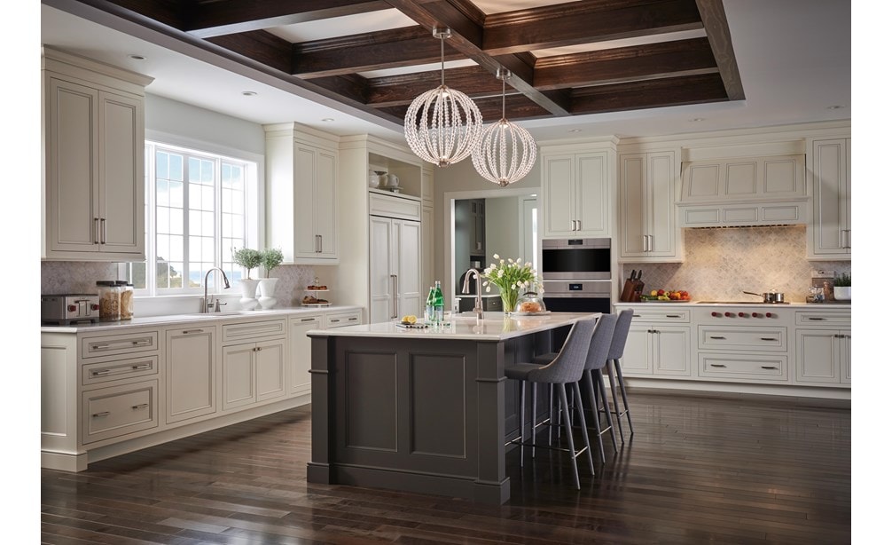 The Wolf 40" Pro Hood Liner 19" Depth (PL401912) shown illuminating cooking area in large open kitchen featuring vintage cabinetry