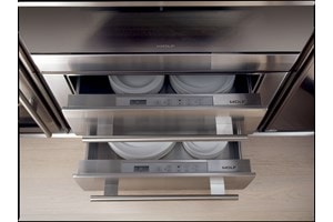 Two Wolf 30" Warming Drawers stacked and holding dishes 
