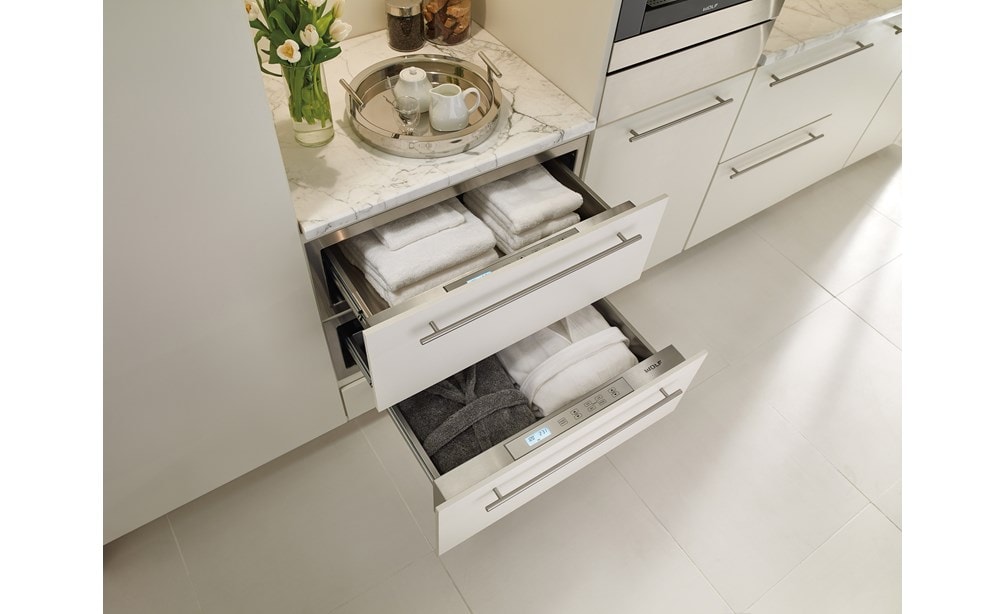 The Wolf 30" Warming Drawer (WD30) shown here with stainless steel drawer fronts blends effortlessly into existing kitchen décor