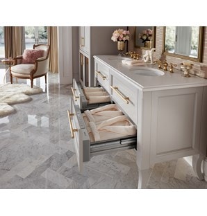 The Wolf 30" Warming Drawer (WD30) shown here keeping bath linens, robes and accessories warm in an elegant bathroom design