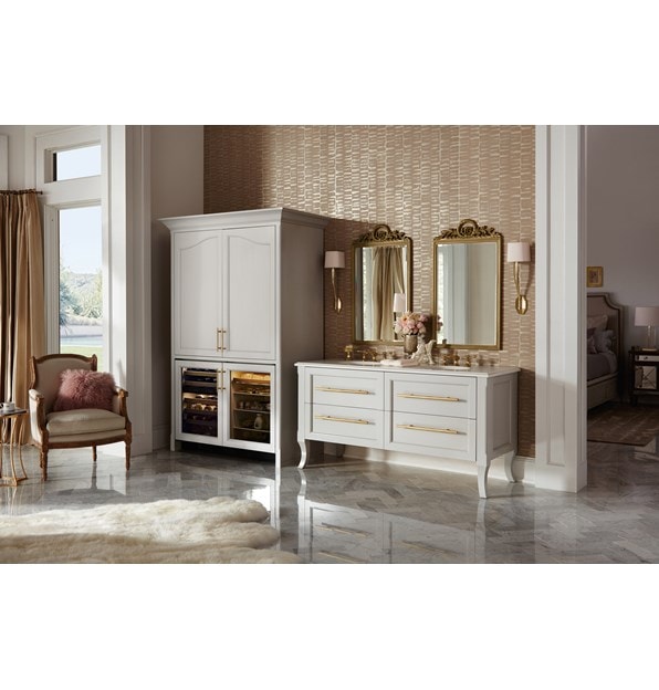 The Sub-Zero 24" Undercounter Beverage Center Panel Ready (UC- 24BG/O) shown blending experty into a rich classic room design