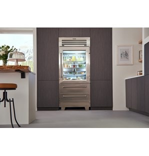 Sub-Zero Pro Glass Door Refrigerator Freezer set in seamless wood grain kitchen cabinets