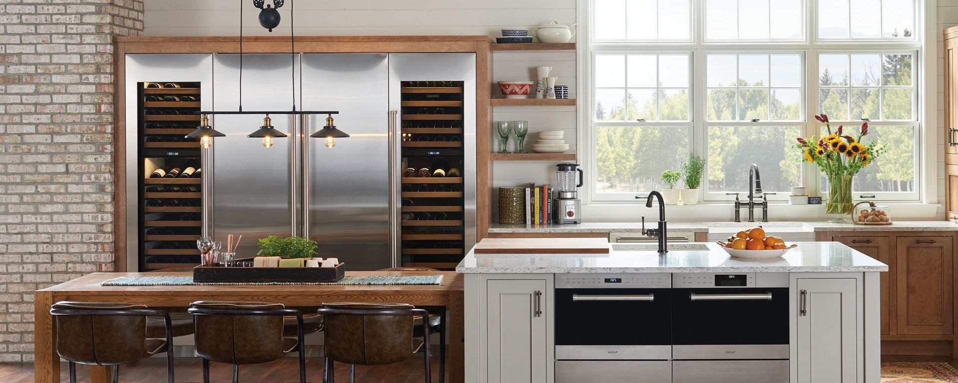 Nordic farmhouse kitchen design featuring Sub-Zero Designer Series Refrigerator and Wine Storage unit with Wolf Induction Range, Microwave Oven and Ventilation Hood