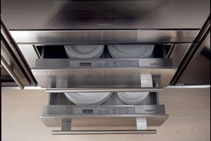 Two Wolf 30&quot; Warming Drawers stacked and holding dishes 