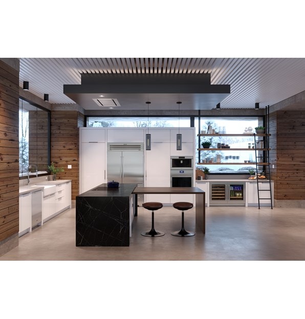 Wolf 36" Contemporary Induction Cooktop shown blending seamlessly in a black marble kitchen island.