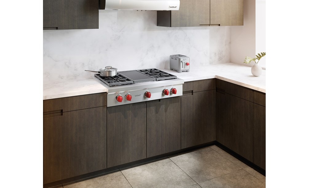 The Wolf 36" Sealed 4 Burner Rangetop and Infrared Charbroiler (SRT364C) shown integrated perfectly in a traditional kitchen setting.