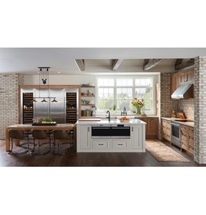 Wolf 24" E series Transitional Drop-Down Door Microwave Oven (MDD24TE/S/TH) shown set flush in large custom granite kitchen island