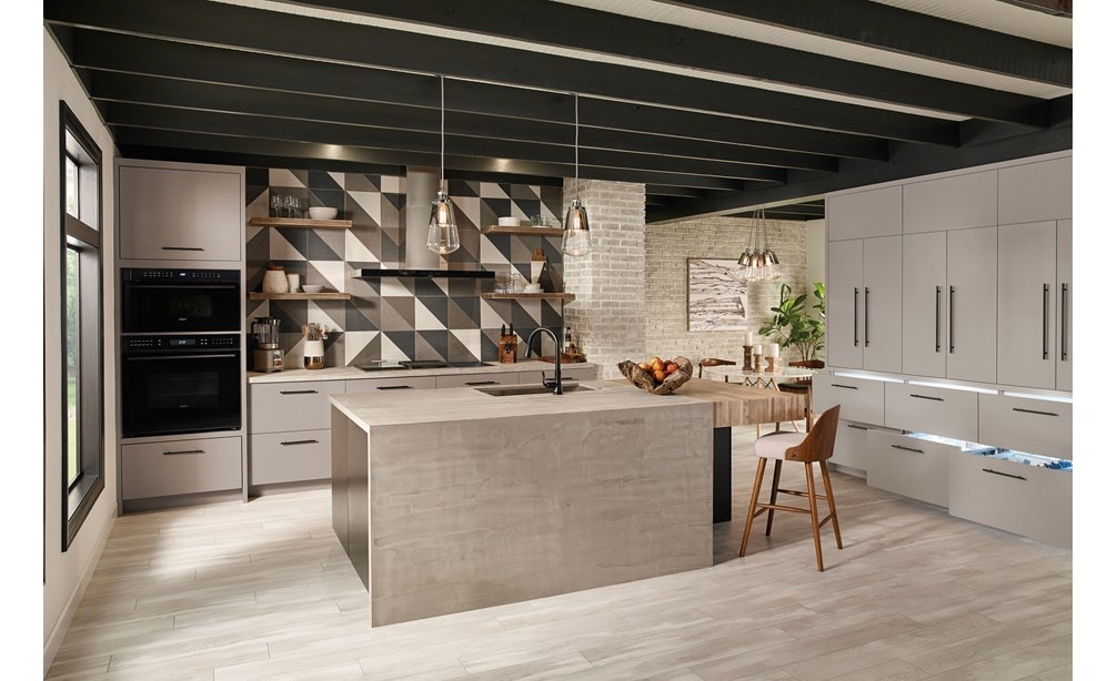 The Wolf 30" M series Contemporary Drop-Down Door Microwave Oven (MDD30CM/B/TH) shown in an open ultra-modern minimalist kitchen design