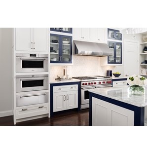 Wolf 30" M series Professional Drop-Down Door Microwave Oven (MDD30PM/S/PH) in shabby-chic kitchen with white cabinets and marble counters