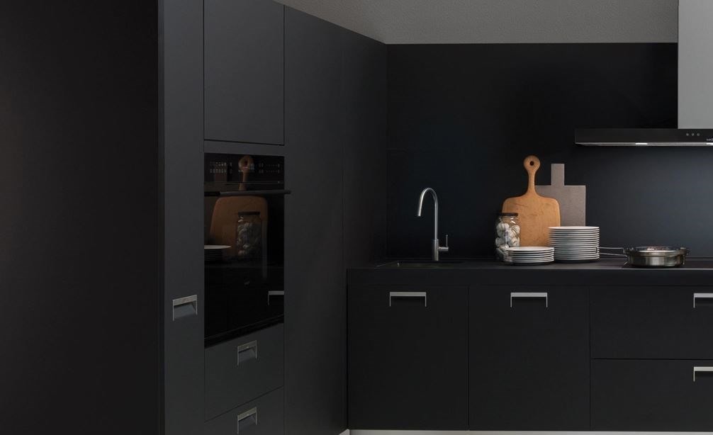 The Wolf 30&quot; E Series Contemporary Single Oven (SO30CE/B/TH) shown blending seamlessly into a sleek dark tone contemporary room design.