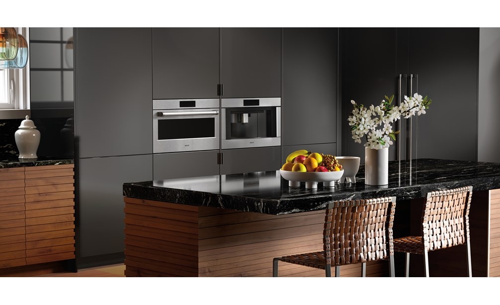 The Wolf 30" E Series Professional Speed Oven - SPO3050PE/S/P next to a Wolf Coffee System