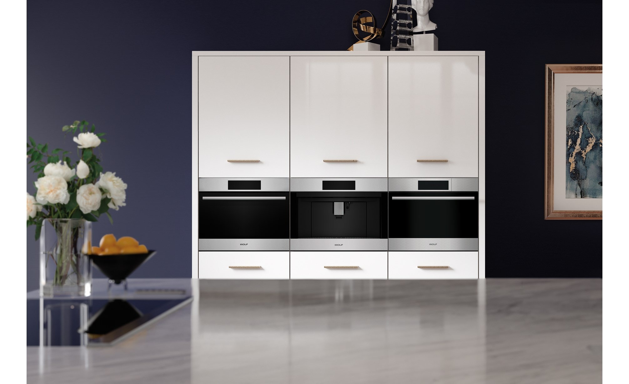 A Wolf built-in speed oven, coffee system, and a convection steam oven side-by-side in a white cabinet