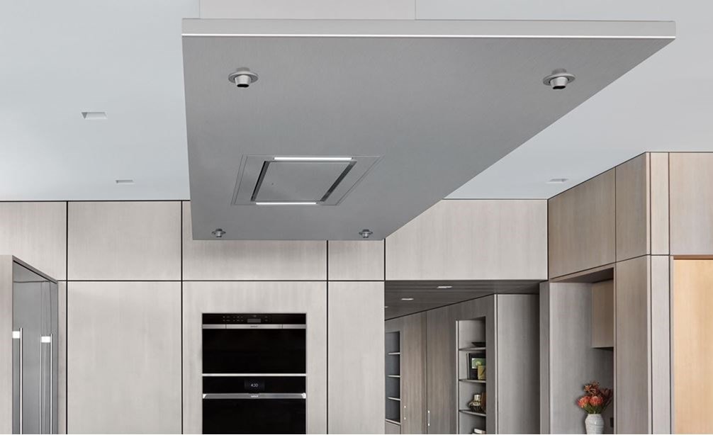 Wolf 36&quot; Ceiling Mounted Hood Stainless Steel (VC36S) shown blending seamlessly above large kitchen island in modern minimalist kitchen