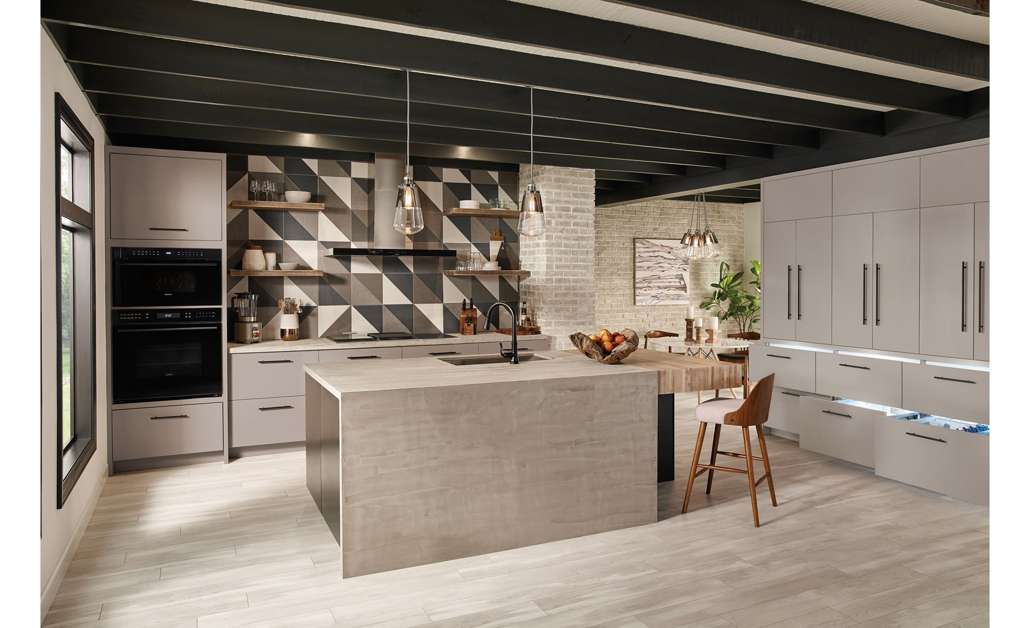 The Wolf 45" Cooktop Wall Hood - Black (VW45B) displayed in an open ultra-modern minimalist kitchen design