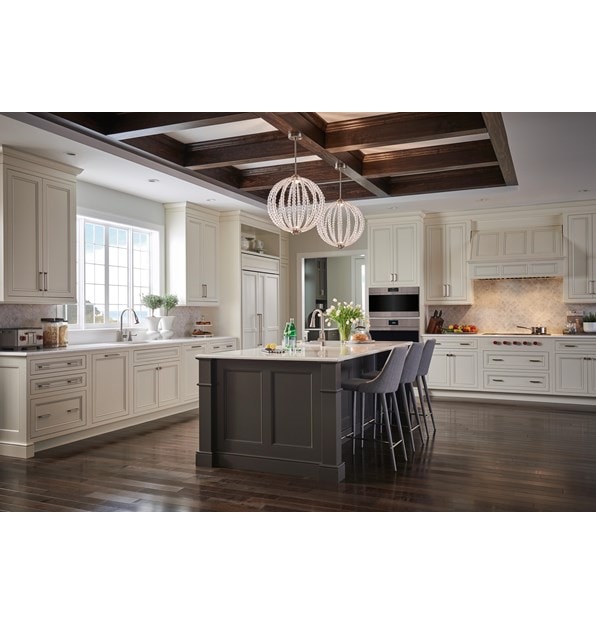 The Wolf 40" Pro Hood Liner 19" Depth (PL401912) shown illuminating cooking area in large open kitchen featuring vintage cabinetry