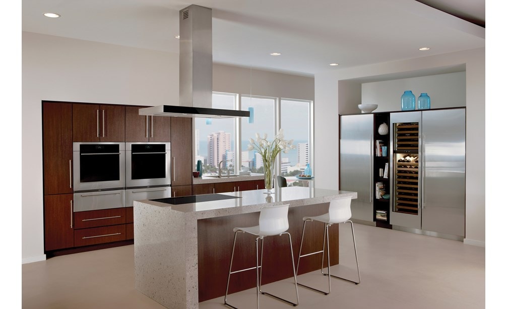 The Wolf 42" Cooktop Island Hood - Black (VI42B) displayed in modern kitchen featuring dark wood cabinetry and stainless-steel accents