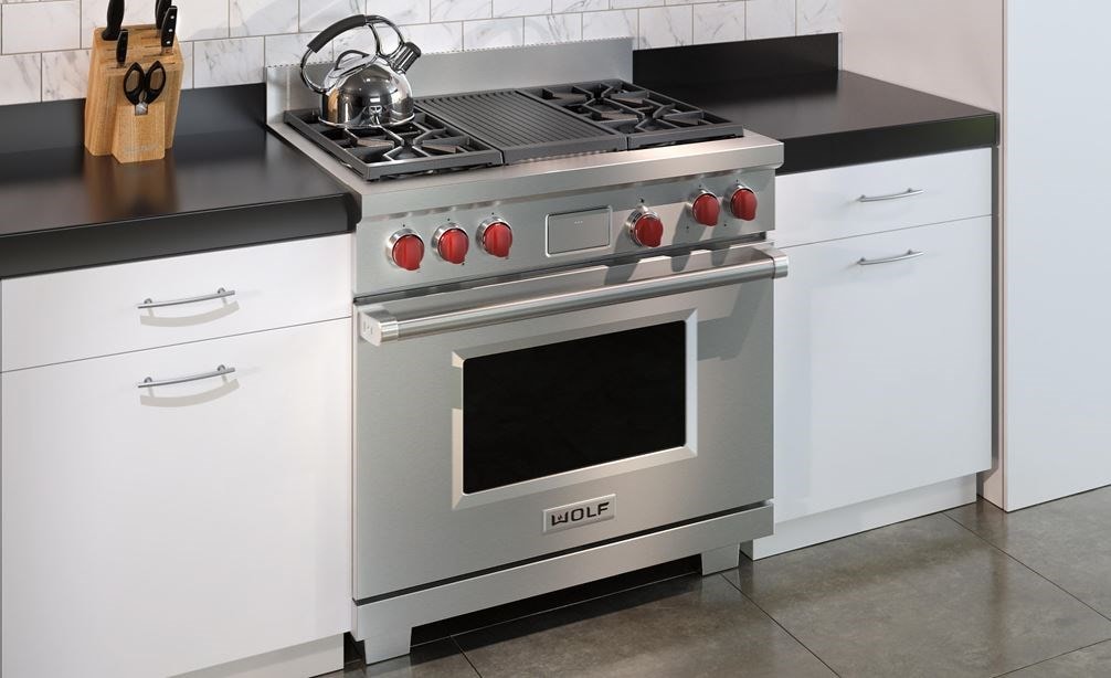The Wolf 36&quot; Dual Fuel Range 4 Burner Infrared Charbroiler (DF364C) shown in a clean contemporary kitchen design.